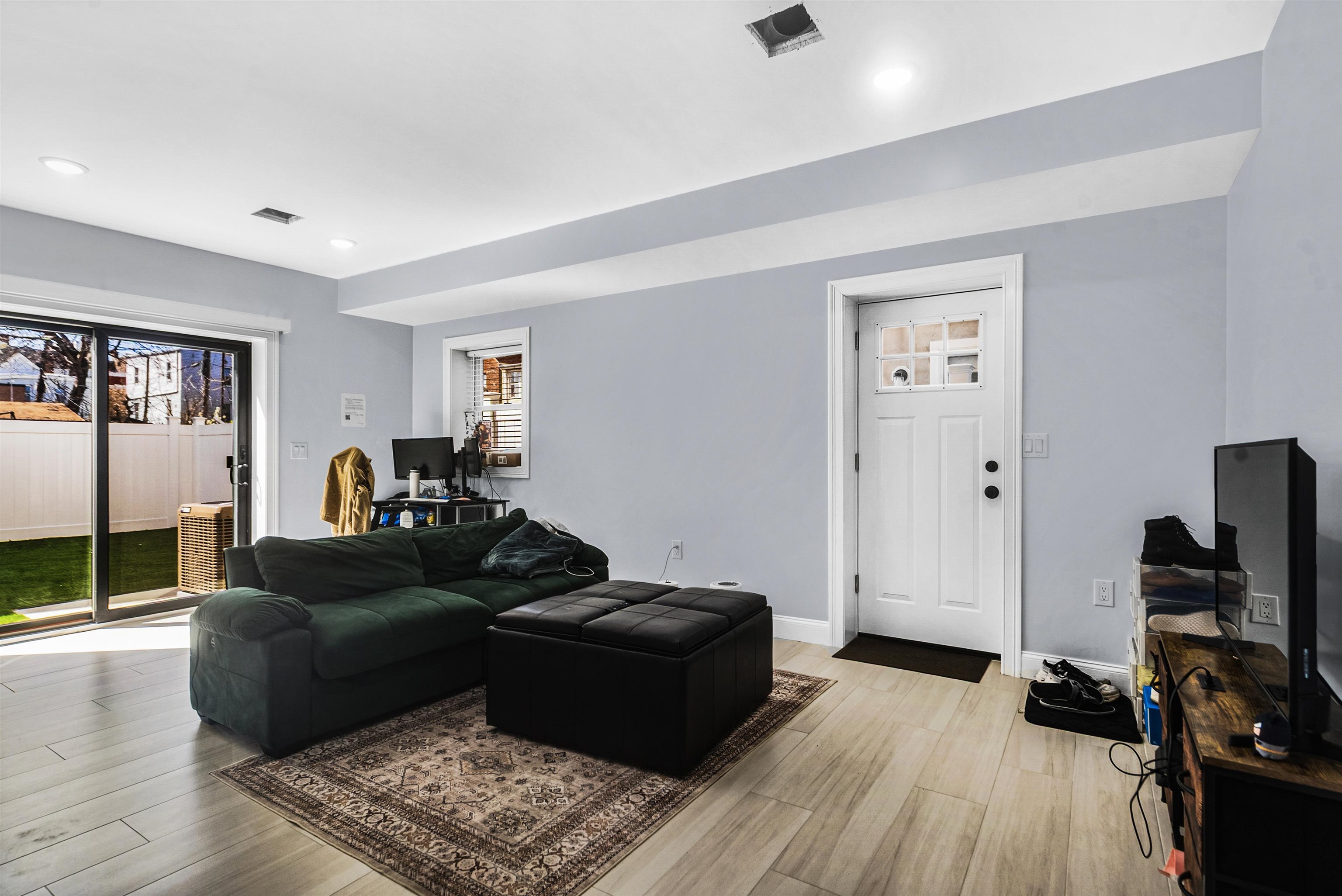 11 South 7th Street Harrison, NJ 07029 - Photo 21 of 29 a living room with furniture and a flat screen tv