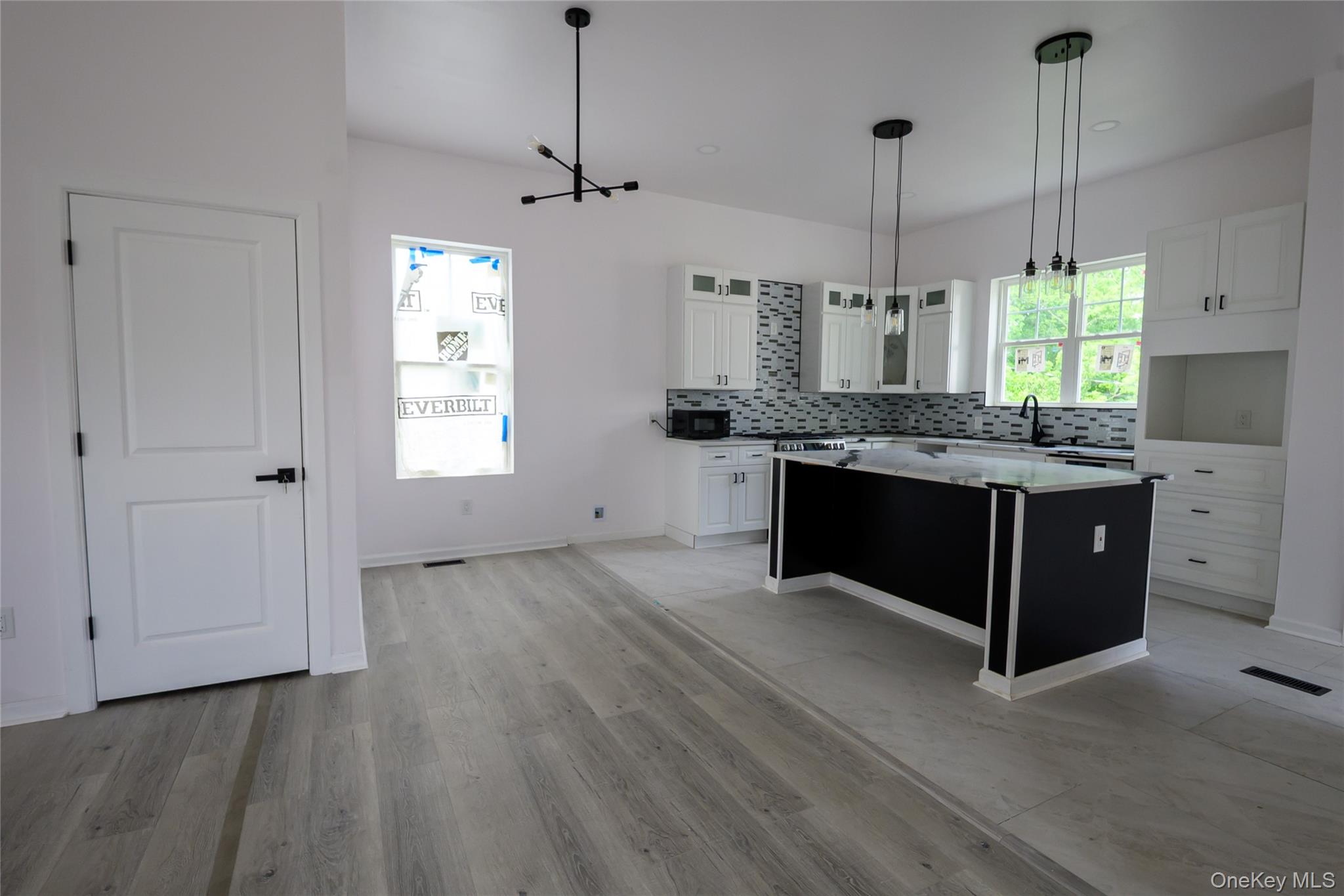 81 Silver Lake Sctn Road Middletown, NY 10940 - Photo 6 of 37 a spacious kitchen with stainless steel appliances granite countertop a stove a sink dishwasher and a wooden floor