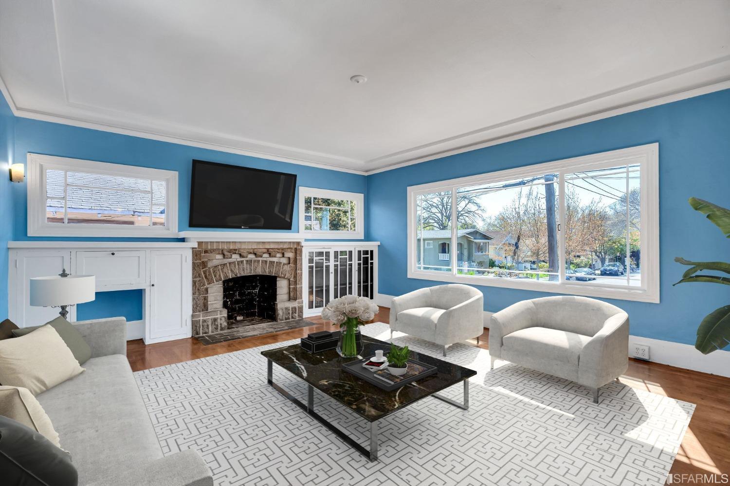 a living room with furniture a fireplace and a flat screen tv