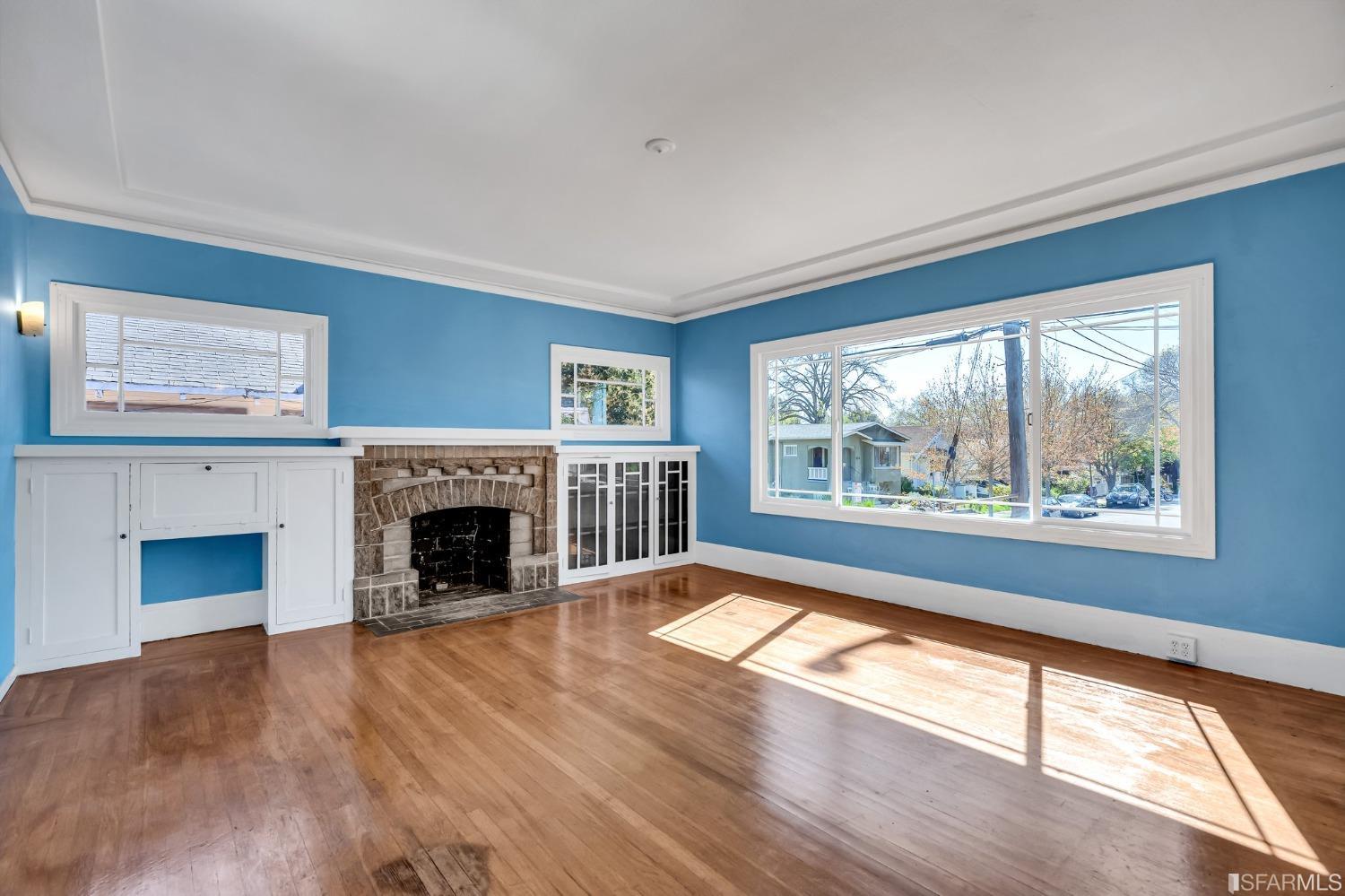 2123 Byron Street Berkeley, CA 94702 - Photo 11 of 54 a view of an empty room with wooden floor and a window