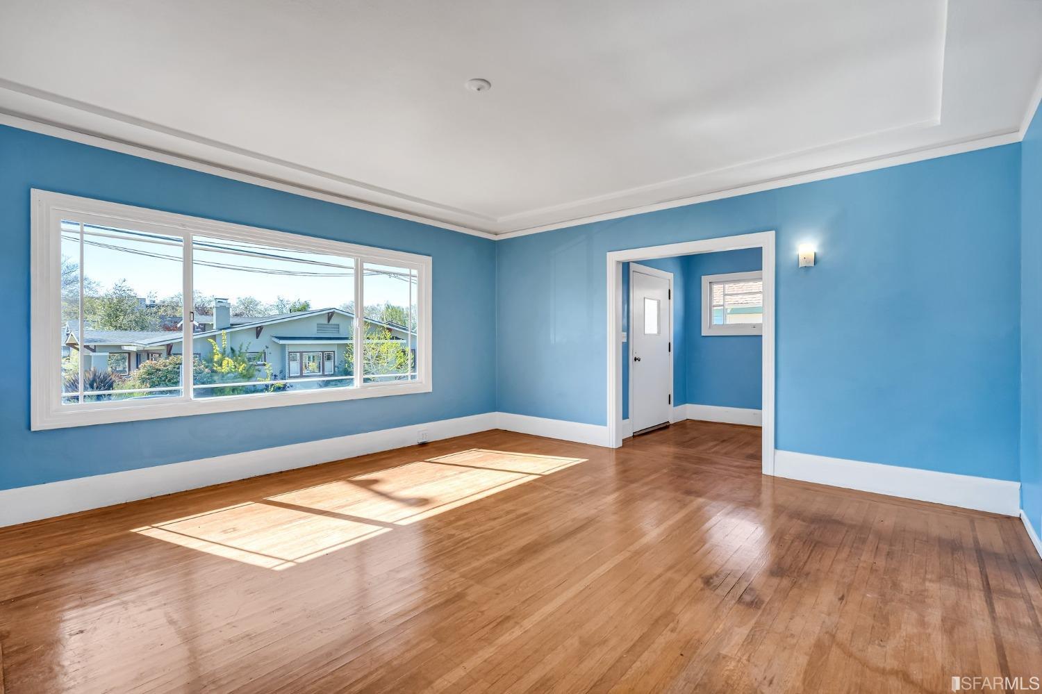 2123 Byron Street Berkeley, CA 94702 - Photo 15 of 54 a view of empty room with wooden floor and fan
