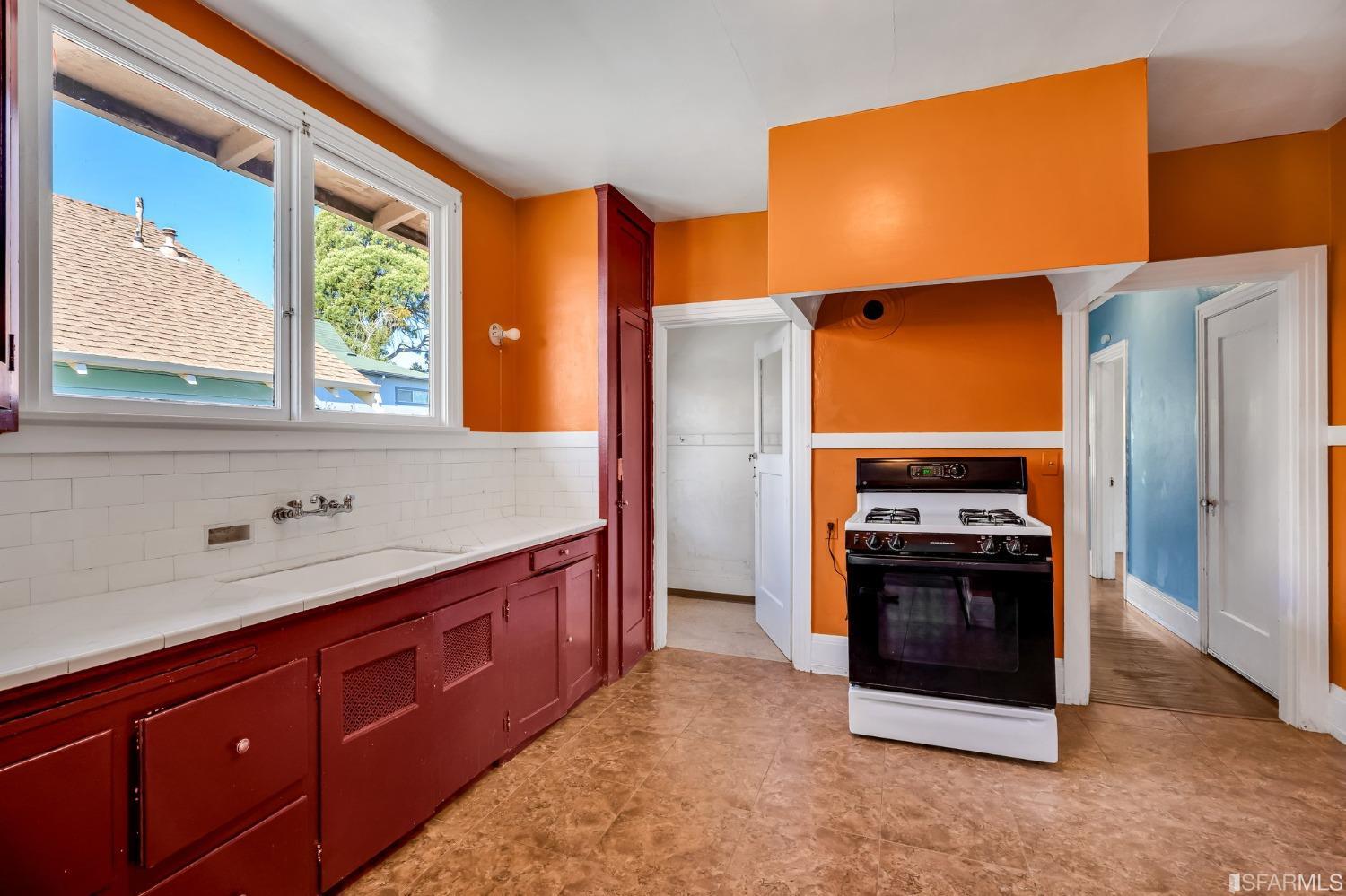 2123 Byron Street Berkeley, CA 94702 - Photo 20 of 54 a kitchen with stainless steel appliances granite countertop a refrigerator and a sink