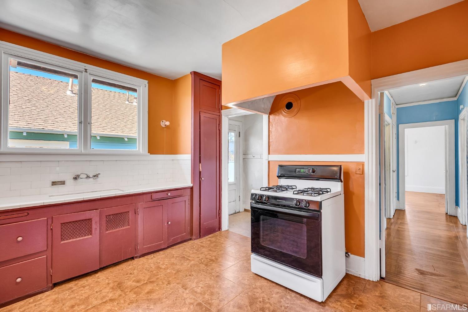 2123 Byron Street Berkeley, CA 94702 - Photo 23 of 54 a kitchen with stainless steel appliances granite countertop a stove a sink and a refrigerator