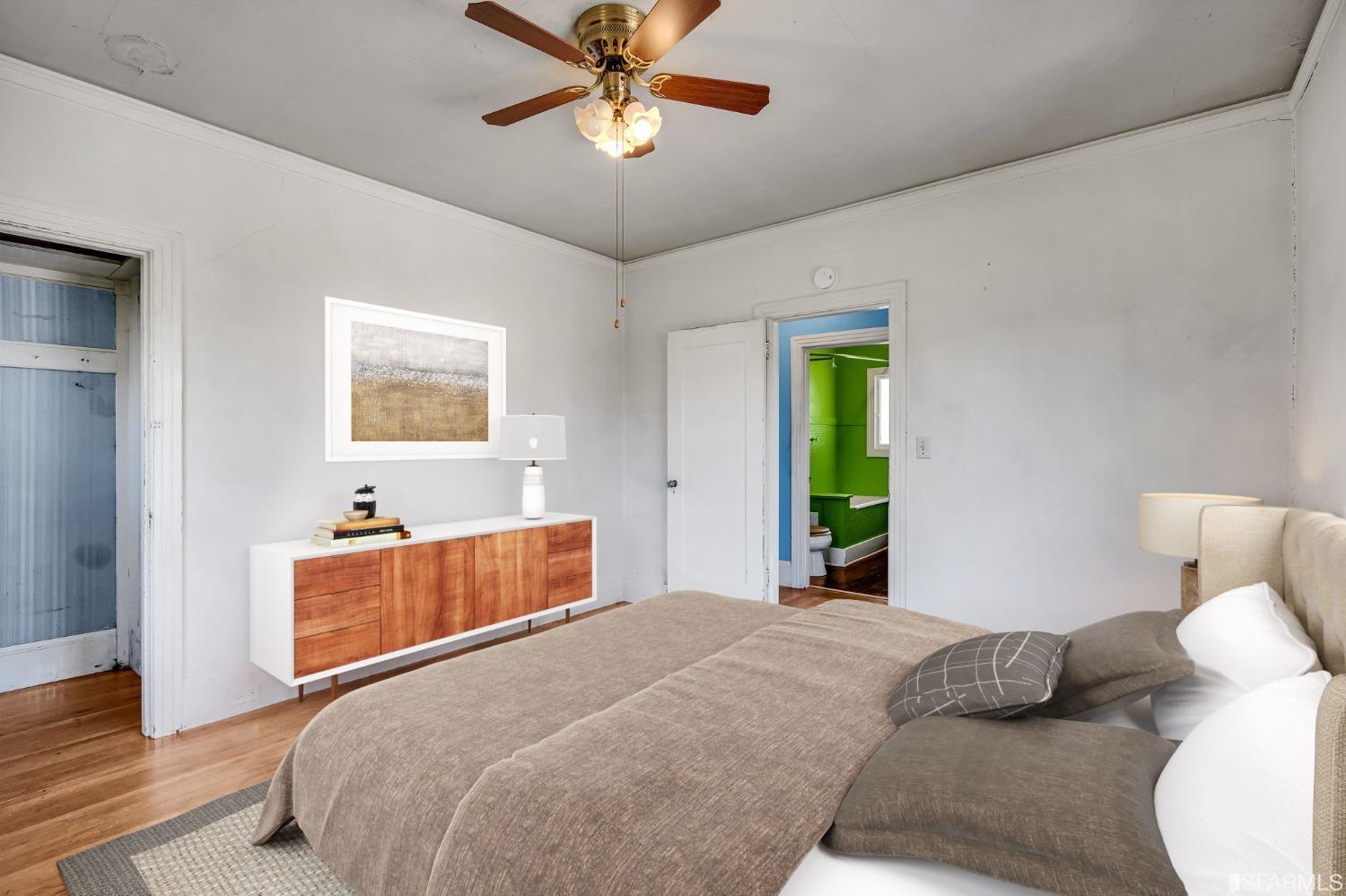 2123 Byron Street Berkeley, CA 94702 - Photo 30 of 54 a bedroom with a bed and a chandelier