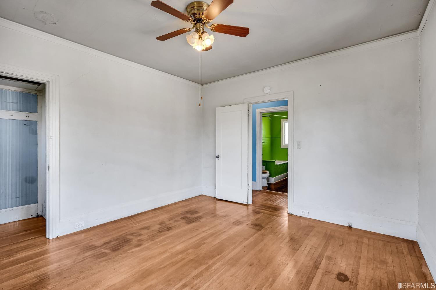 2123 Byron Street Berkeley, CA 94702 - Photo 31 of 54 a view of an empty room with wooden floor and a window