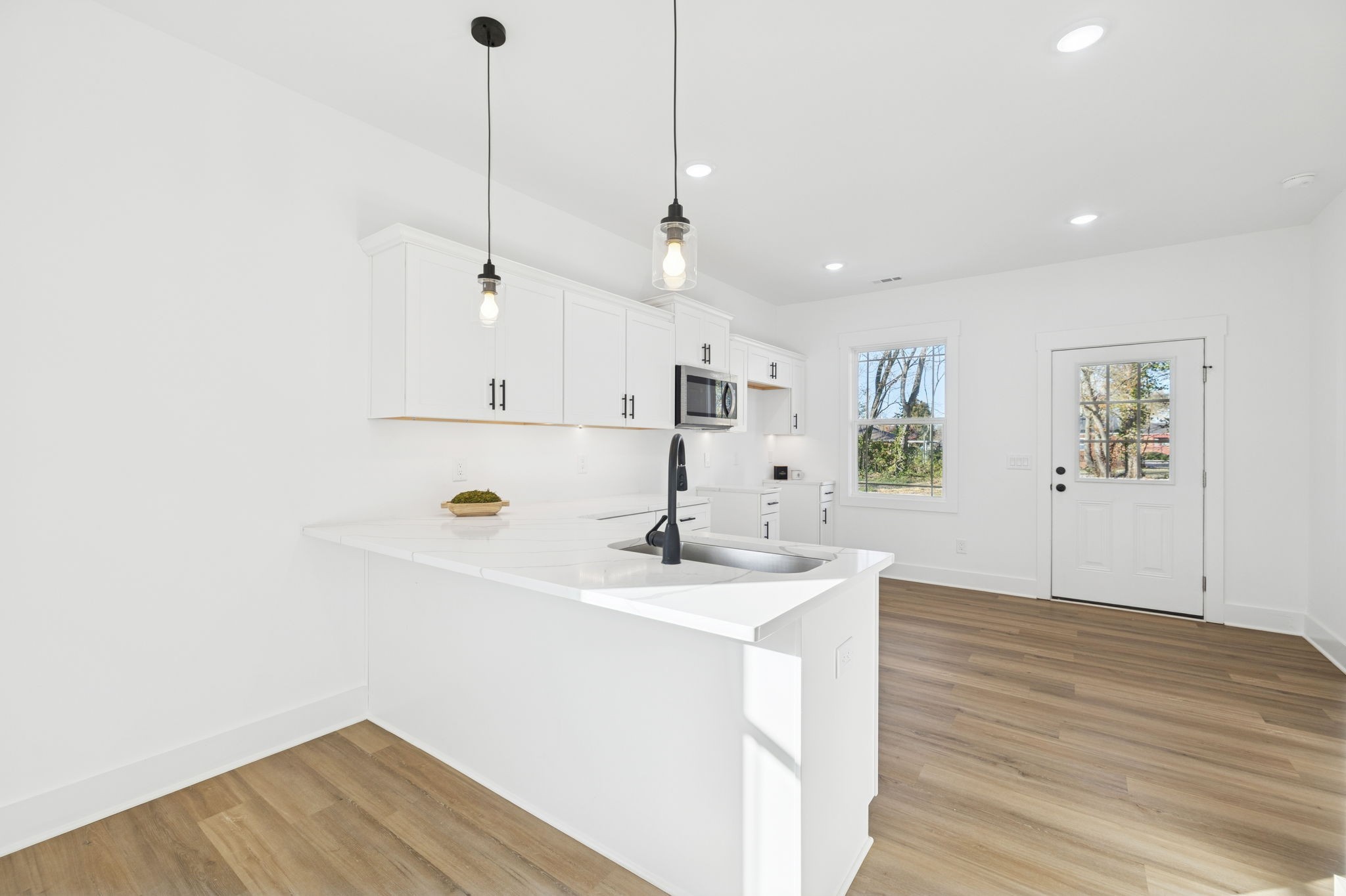 1511 Cheatham Street Springfield, TN 37172 - Photo 9 of 24 a view of a kitchen with wooden floor