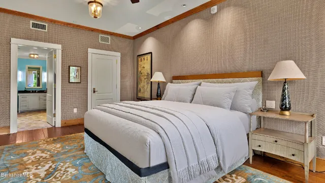 a bedroom with a bed and a walk in closet