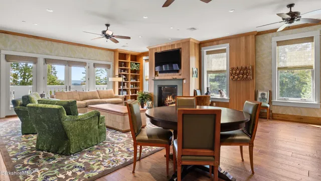 a view of a dining room with furniture window and wooden floor