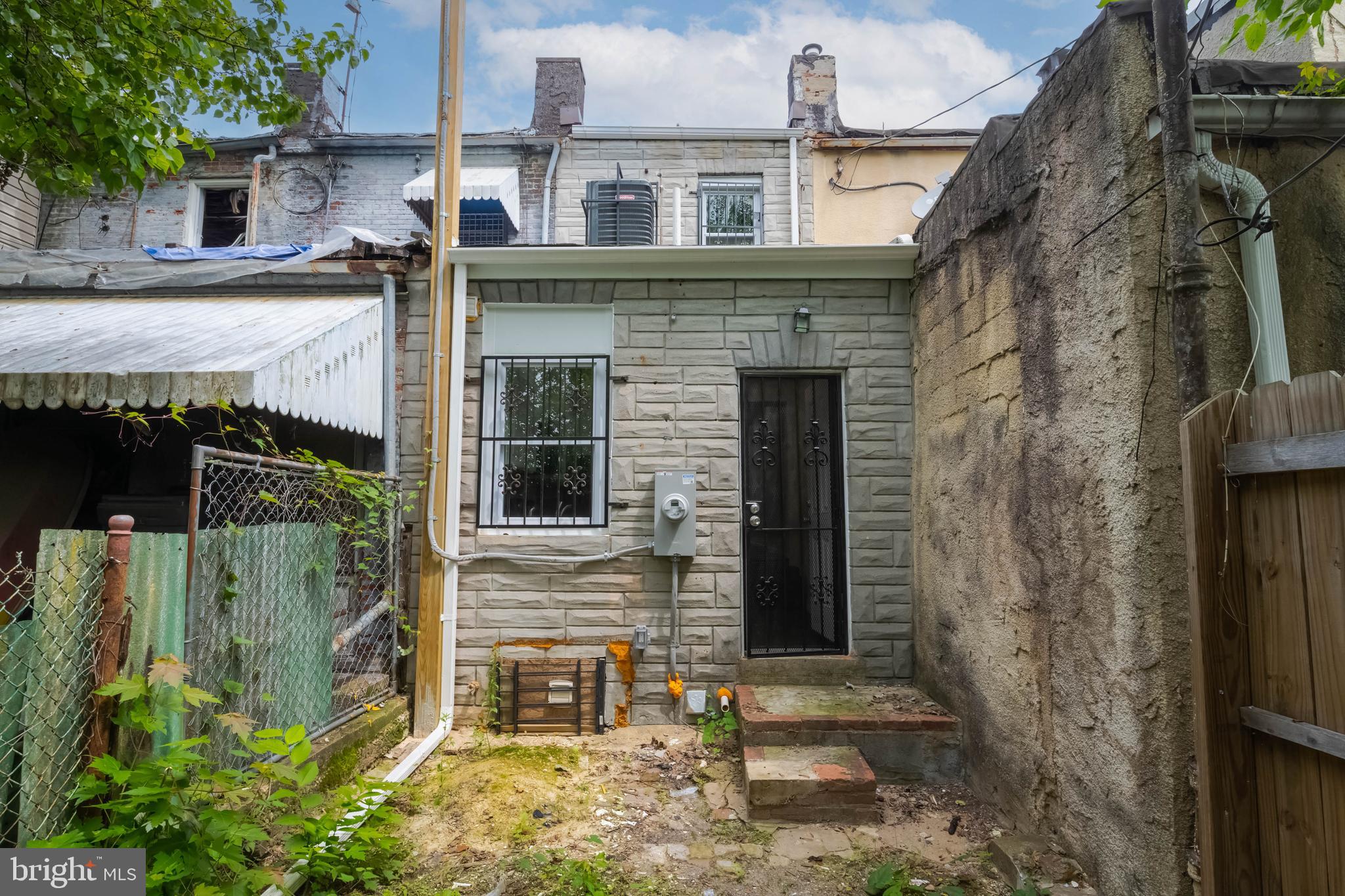 1839 Ramsay Street Baltimore, MD 21223 - Photo 21 of 22 front view of a house with a brick wall
