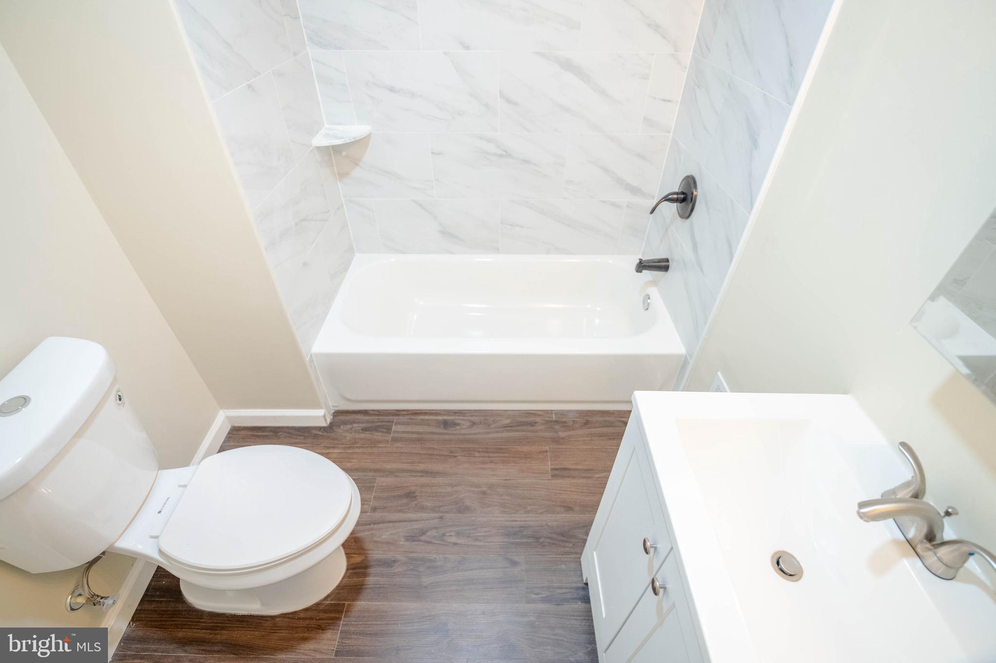 1839 Ramsay Street Baltimore, MD 21223 - Photo 9 of 22 a bathroom with a toilet and a tub