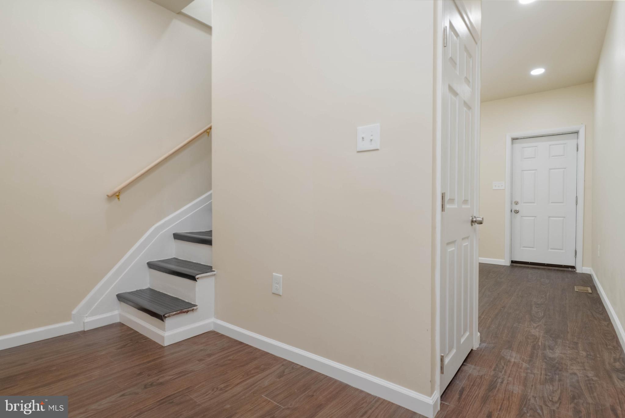 1839 Ramsay Street Baltimore, MD 21223 - Photo 10 of 22 a view of an empty room with stairs and ventilation