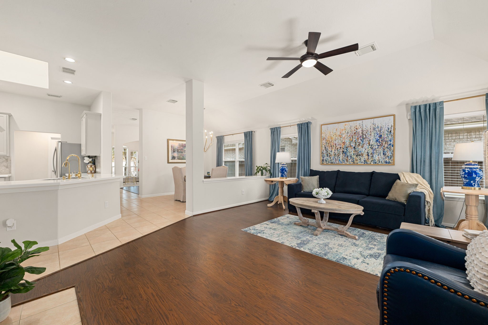 20707 Sapphire Lake Road Richmond, TX 77407 - Photo 12 of 35 Wood-look laminate flooring in the family room.