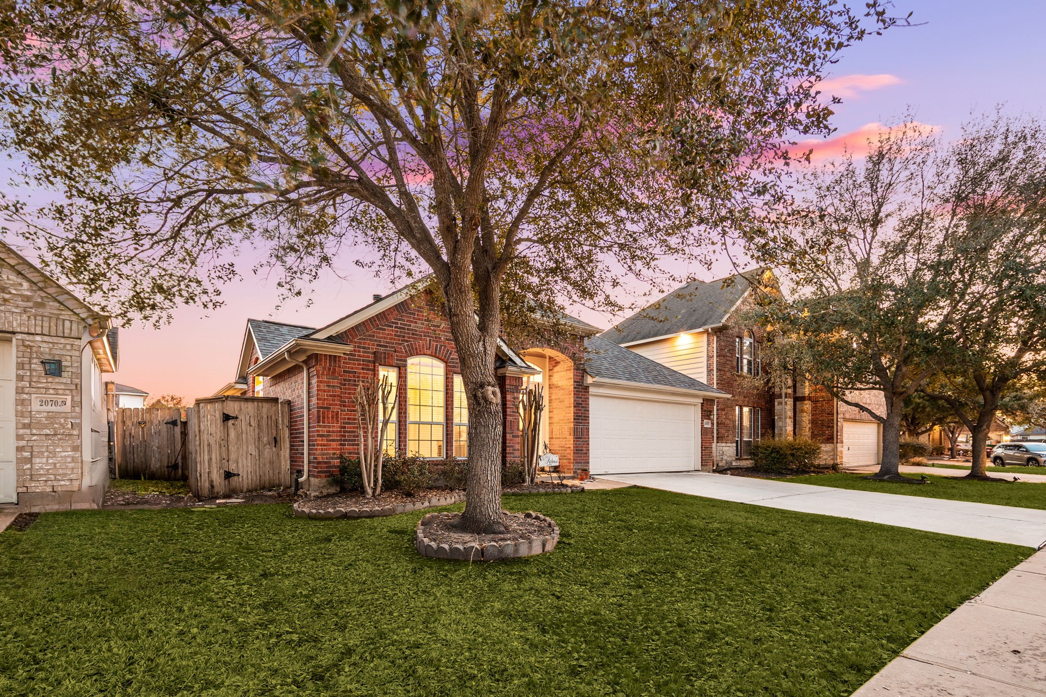 20707 Sapphire Lake Road Richmond, TX 77407 - Photo 2 of 13 A mature Oak Tree graces this front yard.