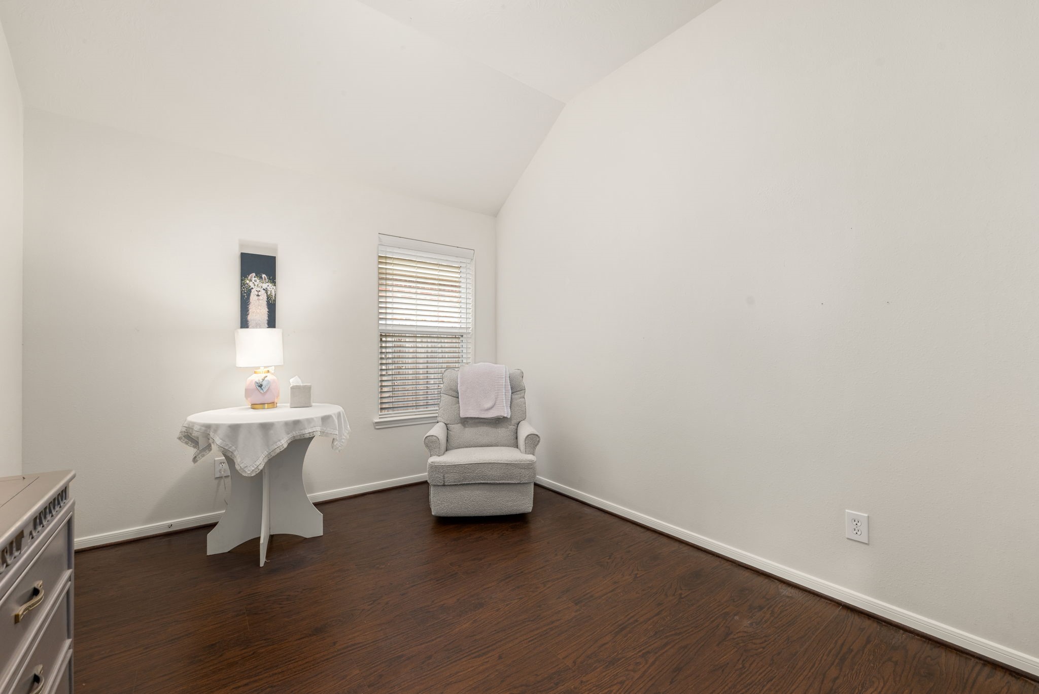 20707 Sapphire Lake Road Richmond, TX 77407 - Photo 25 of 35 Secondary bedroom number 1 of 3 with warm wood-look laminate flooring and high ceilings.