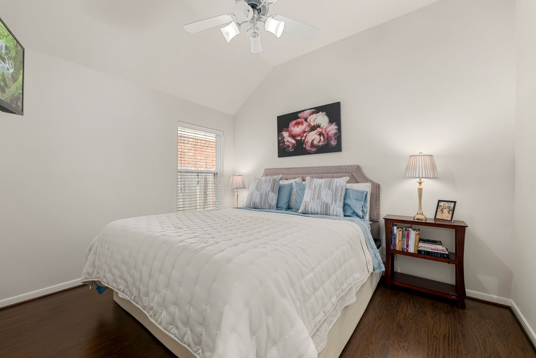 20707 Sapphire Lake Road Richmond, TX 77407 - Photo 27 of 35 Secondary bedroom number 2 of 3 is spacious with a walk-in closet. King-size bed with 2 side tables shown.