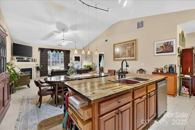 a view of a kitchen counter space and breakfast area