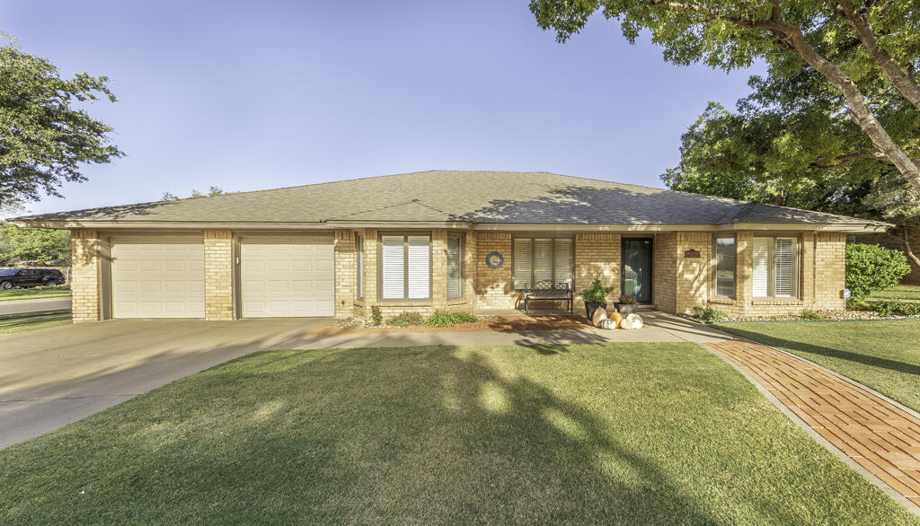 3620 93rd Street Lubbock, TX 79423 - Photo 2 of 33 a view of a house with swimming pool and sitting area