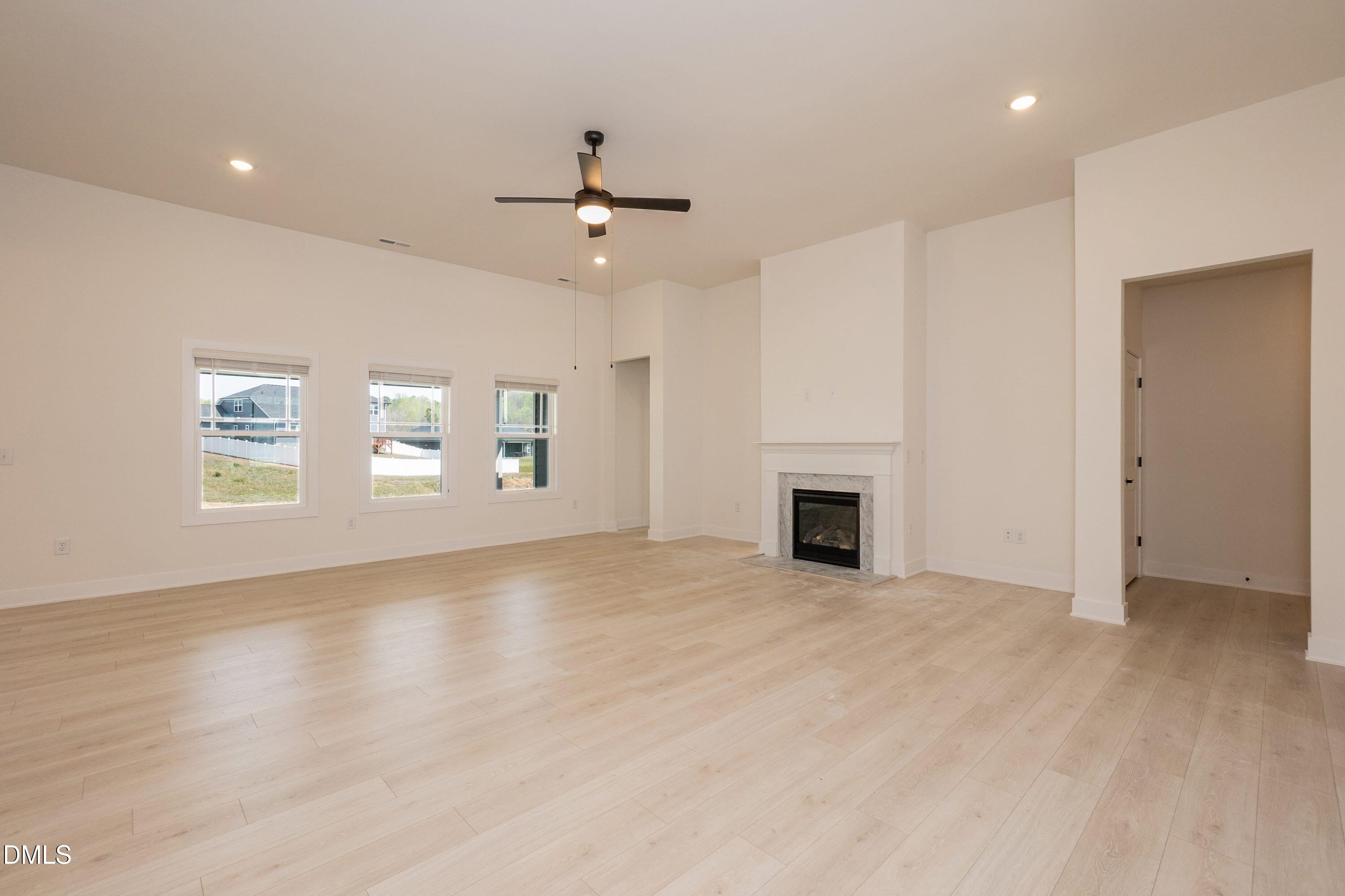 180 Galway Road Lillington, NC 27546 - Photo 18 of 41 an empty room with windows and fireplace