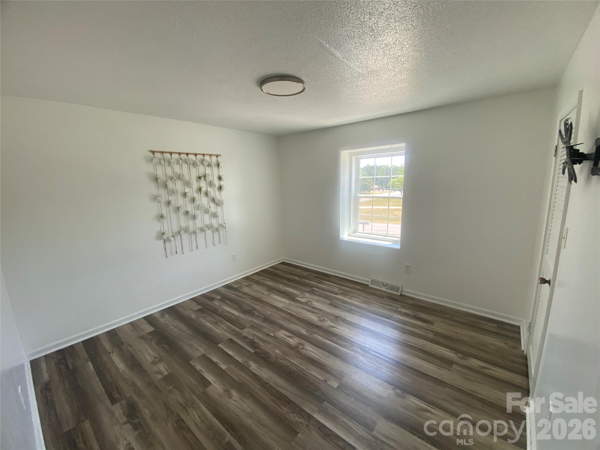 788 Coley Road Salisbury, NC 28146 - Photo 25 of 43 an empty room with windows