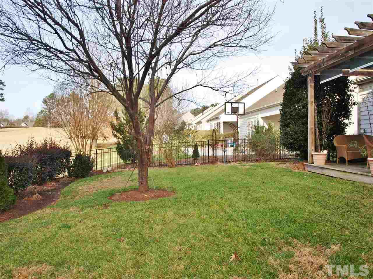 3609 Cathedral Bell Road Raleigh, NC 27614 - Photo 20 of 23 a tree in the middle of a yard