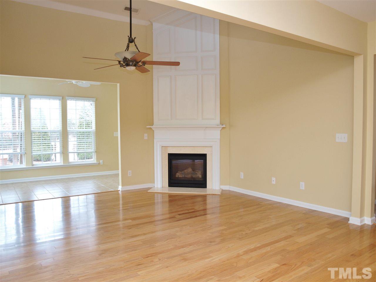 3609 Cathedral Bell Road Raleigh, NC 27614 - Photo 3 of 23 a view of a livingroom with a fireplace and window