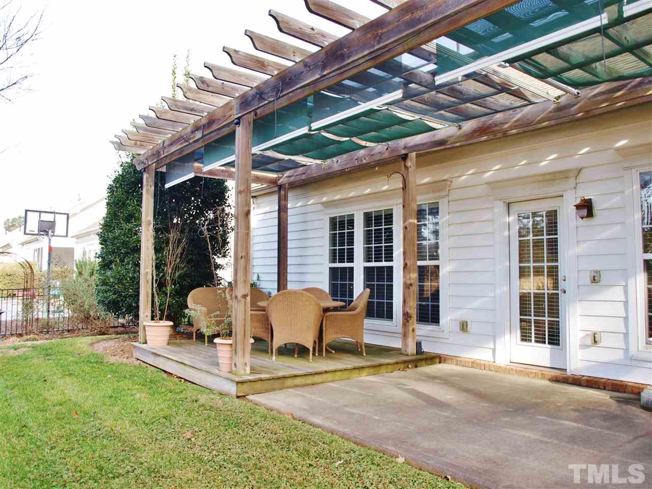 3609 Cathedral Bell Road Raleigh, NC 27614 - Photo 23 of 23 a view of a patio with table and chairs and potted plants
