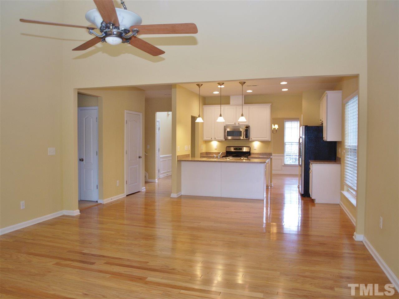 3609 Cathedral Bell Road Raleigh, NC 27614 - Photo 5 of 23 a view of a kitchen with a refrigerator and a microwave