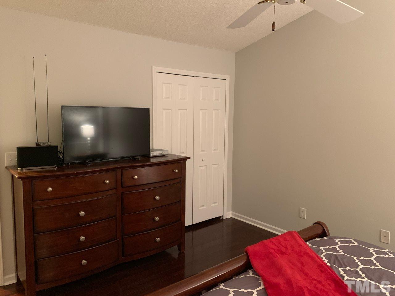 4516 Drewbridge Way Raleigh, NC 27604 - Photo 12 of 23 a living room with furniture and a flat screen tv