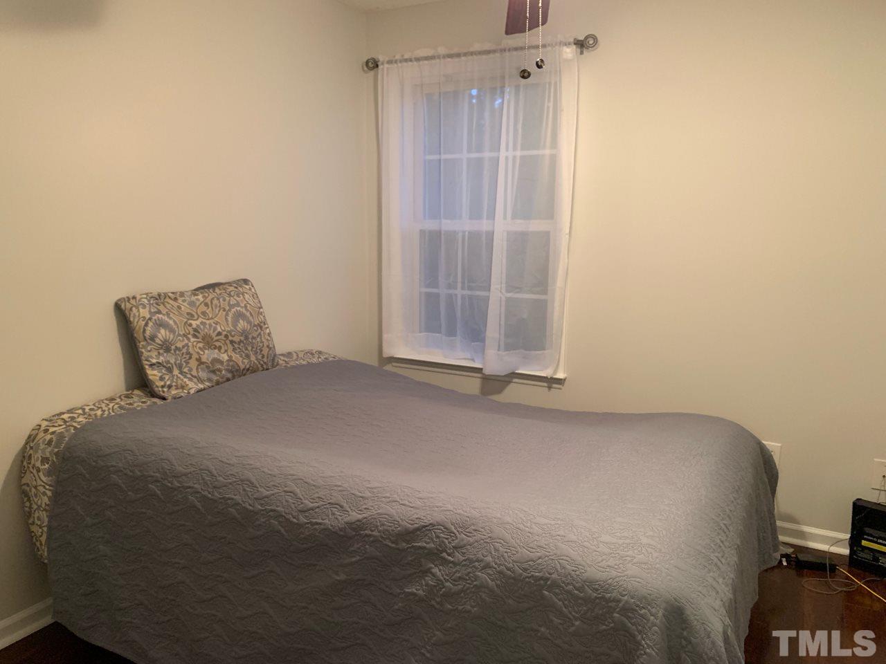 4516 Drewbridge Way Raleigh, NC 27604 - Photo 17 of 23 a room with a bed