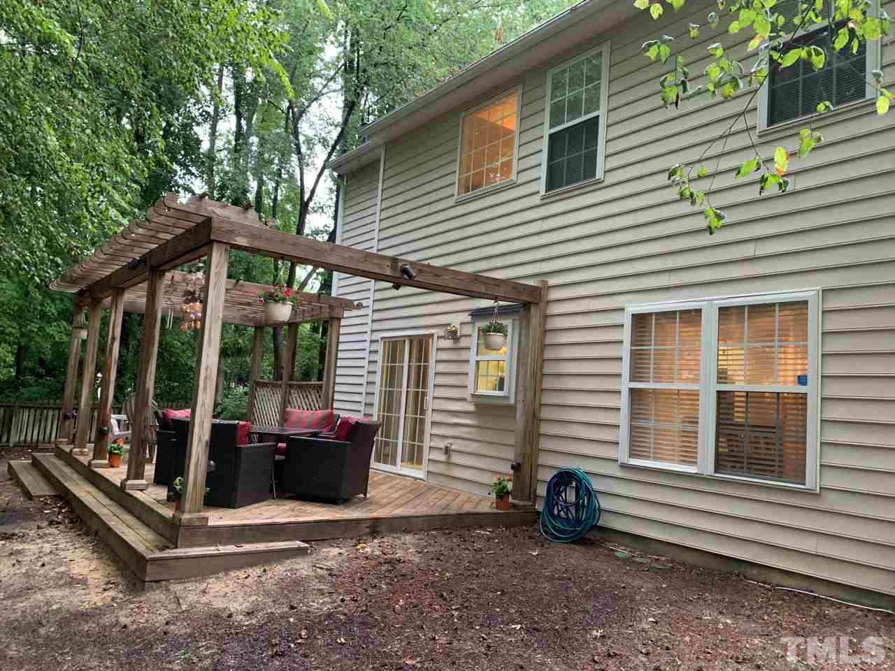 4516 Drewbridge Way Raleigh, NC 27604 - Photo 20 of 23 a view of a house with backyard and porch