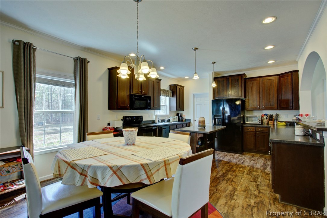 1496 Elsom Mascot Road Mattaponi, VA 23110 - Photo 7 of 33 a large kitchen with a table and chairs