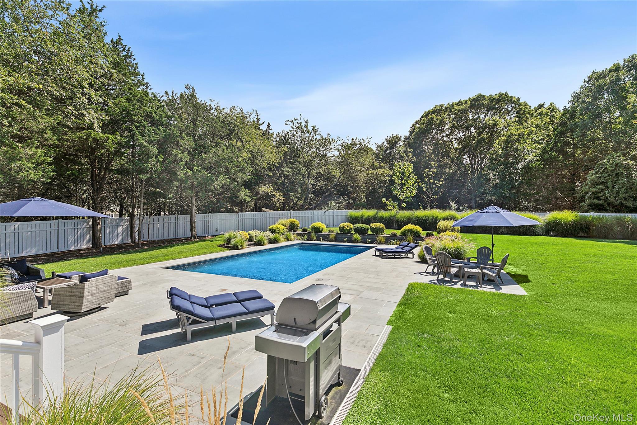 3470 North Bayview Road Southold, NY 11971 - Photo 18 of 25 View of swimming pool featuring an outdoor hangout area, a patio, a fenced backyard, and grilling area