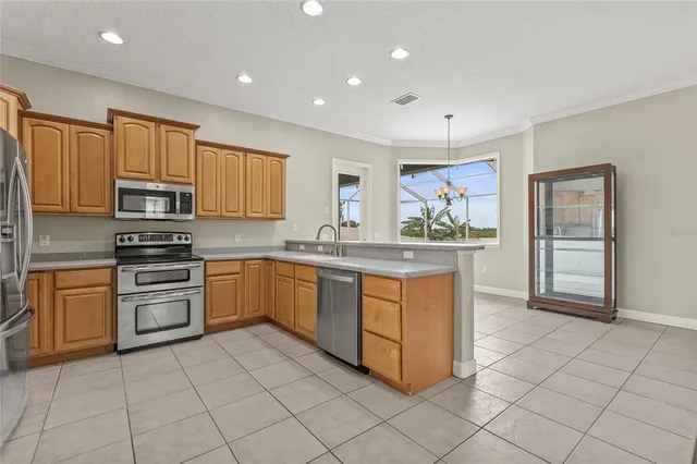 a kitchen with a stove sink and a refrigerator