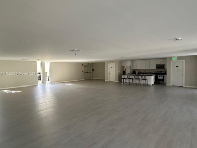 8015 Southwest 107th Avenue, Unit 201 Miami, FL 33173 - Photo 23 of 24 a view of a work space with wooden floor