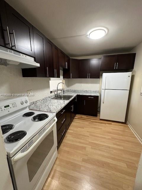 8015 Southwest 107th Avenue, Unit 201 Miami, FL 33173 - Photo 3 of 24 a kitchen with a stove and a sink