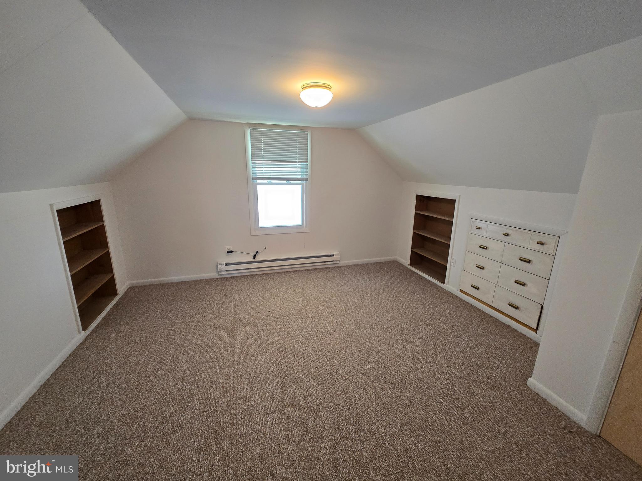 8193 Gumtree Drive Dundalk, MD 21222 - Photo 12 of 26 an empty room with windows and cabinet
