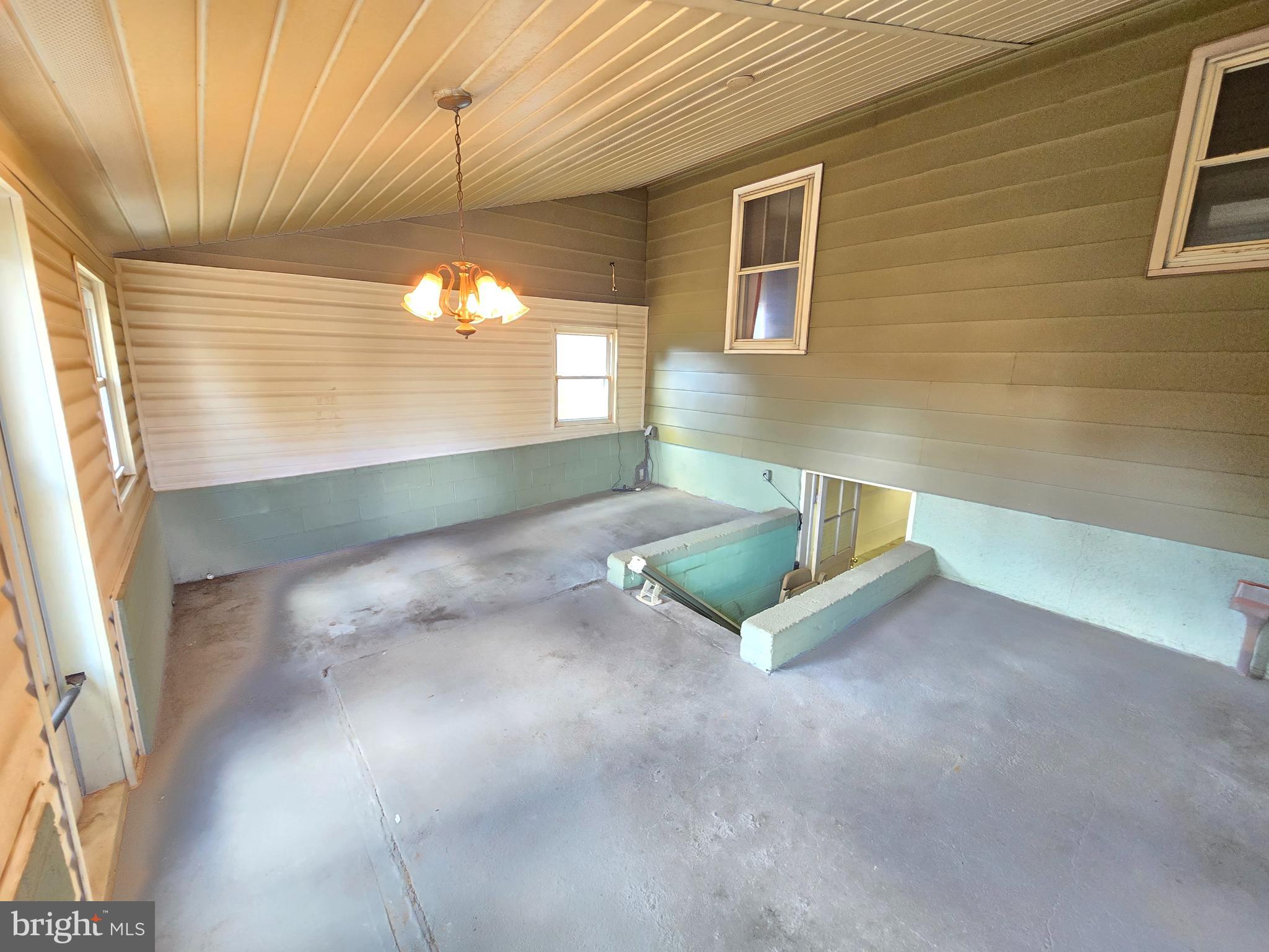 8193 Gumtree Drive Dundalk, MD 21222 - Photo 20 of 26 a view of a livingroom with a ceiling fan and window