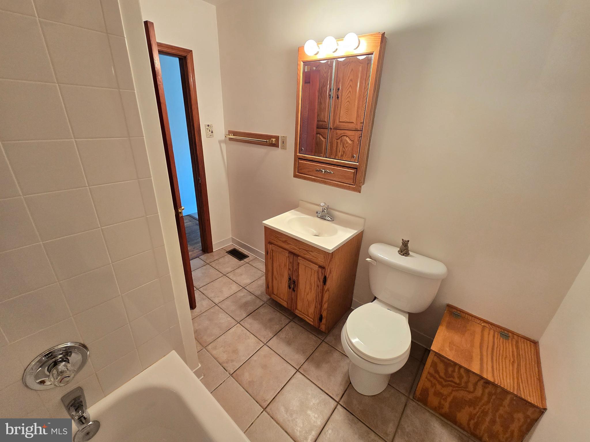 8193 Gumtree Drive Dundalk, MD 21222 - Photo 9 of 26 a bathroom with a toilet and a sink