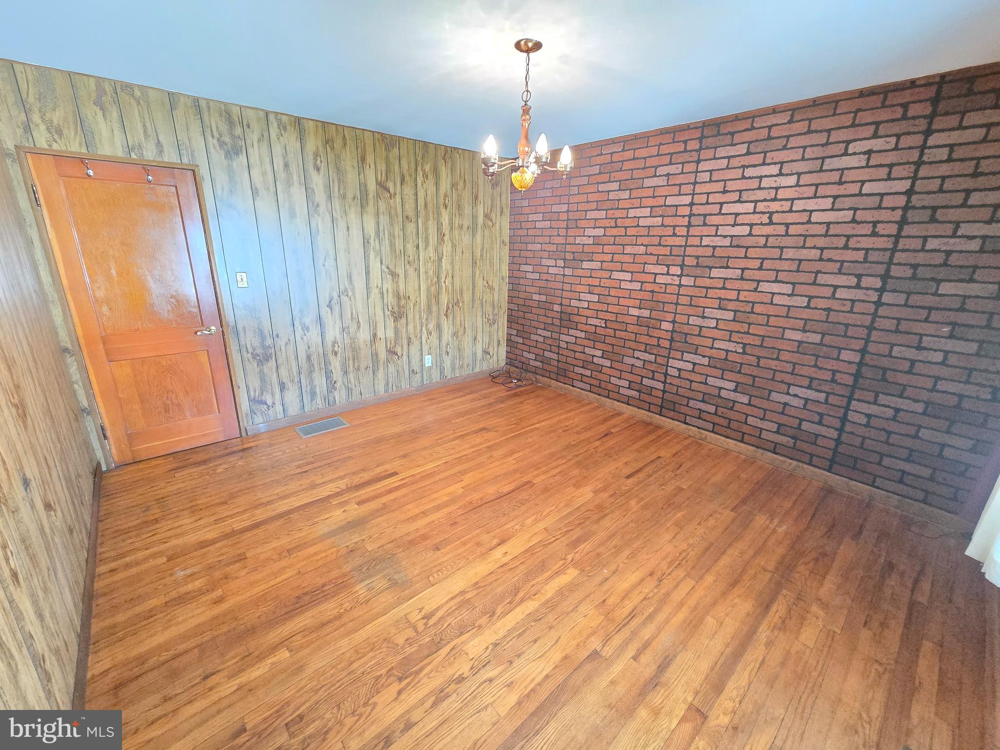 8193 Gumtree Drive Dundalk, MD 21222 - Photo 10 of 26 a view of empty room with wooden floor and fan