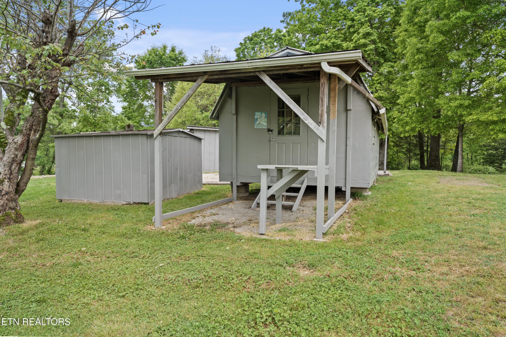 292 Buckner Road Philadelphia, TN 37846 - Photo 33 of 38 a view of a chair and table in backyard of the house