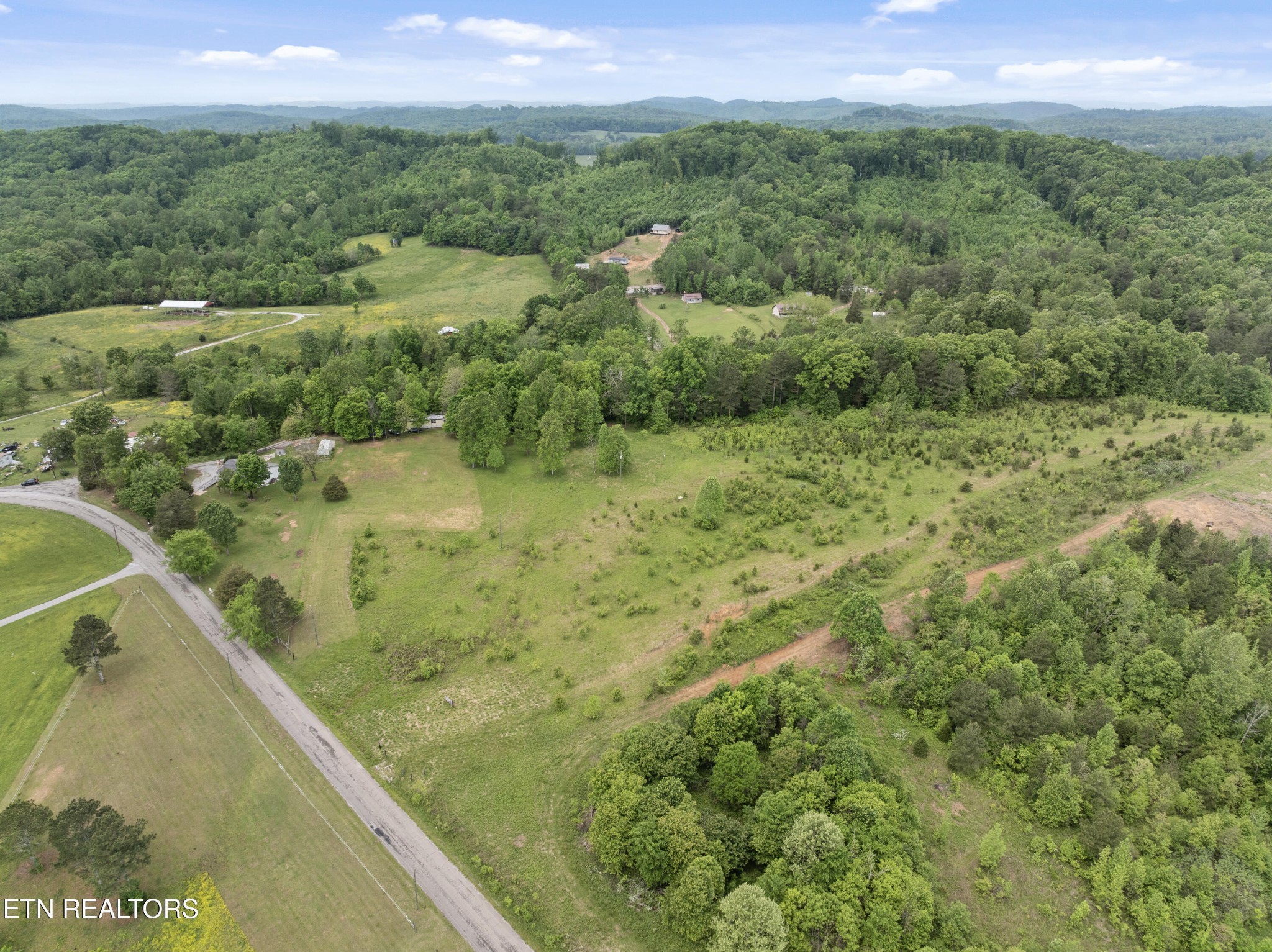 292 Buckner Road Philadelphia, TN 37846 - Photo 38 of 38 a view of a lake with a mountain in the background