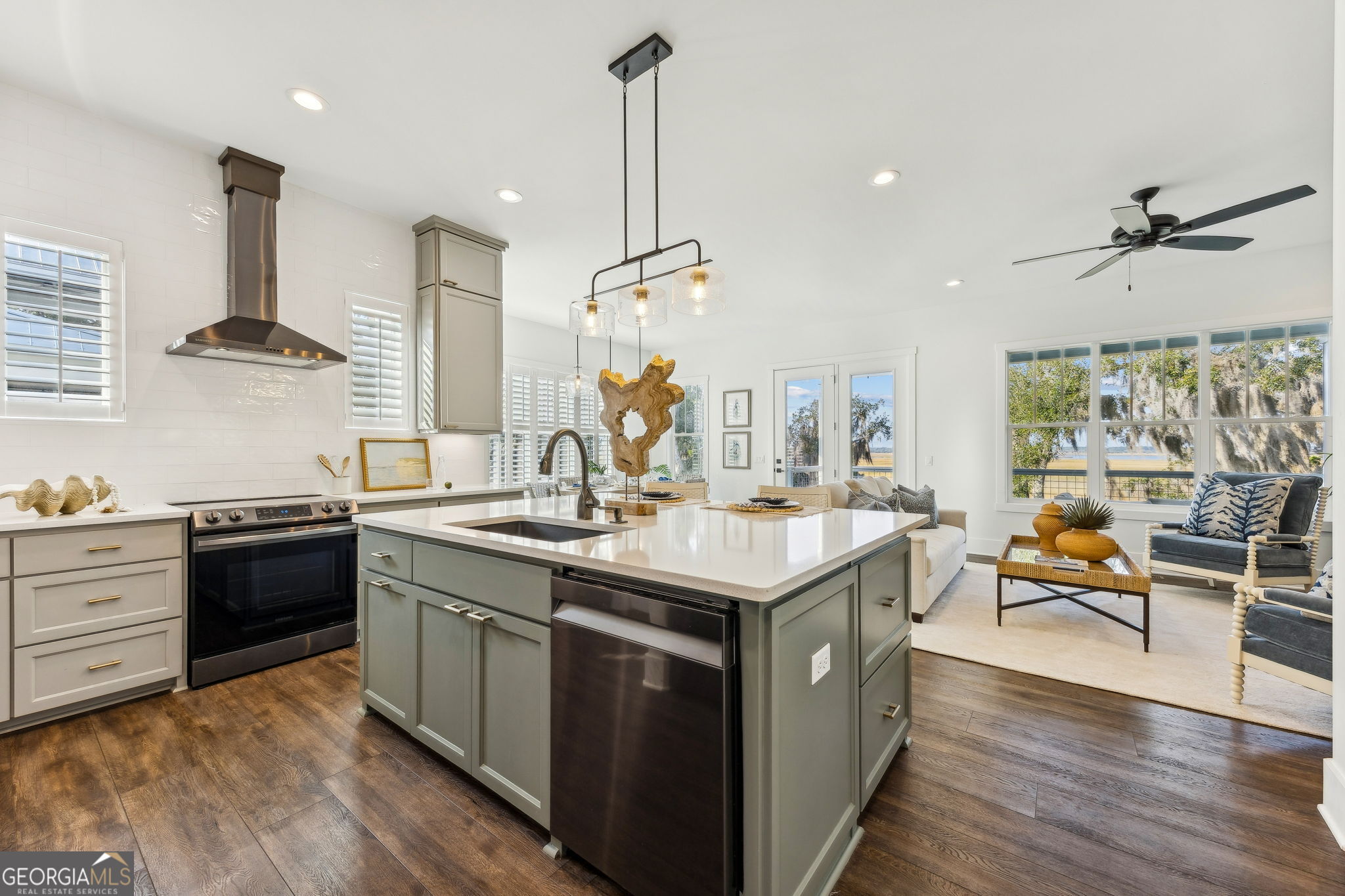 109 Becket Road St. Marys, GA 31558 - Photo 14 of 65 a kitchen with stainless steel appliances granite countertop a sink stove and wooden floor