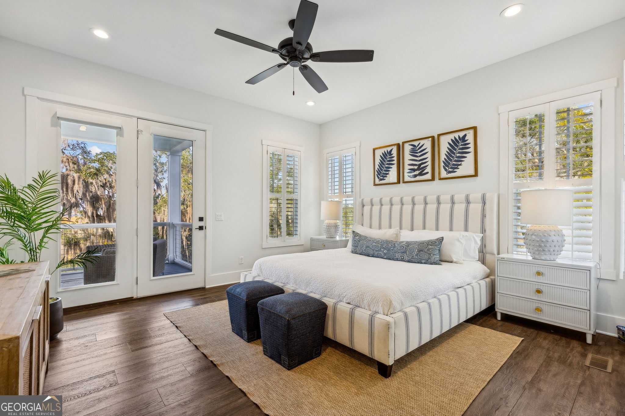 109 Becket Road St. Marys, GA 31558 - Photo 20 of 65 a bedroom with a large bed and a chandelier