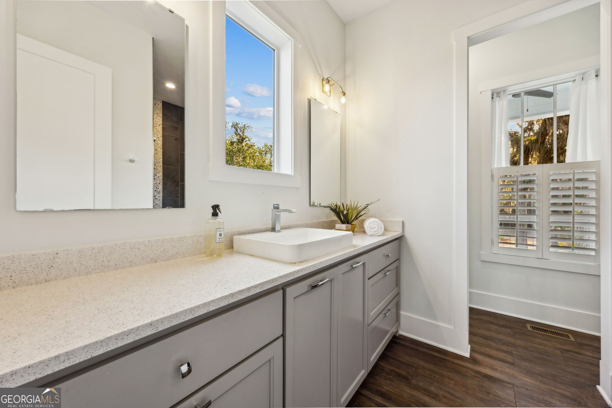 109 Becket Road St. Marys, GA 31558 - Photo 21 of 65 a bathroom with a sink and a mirror
