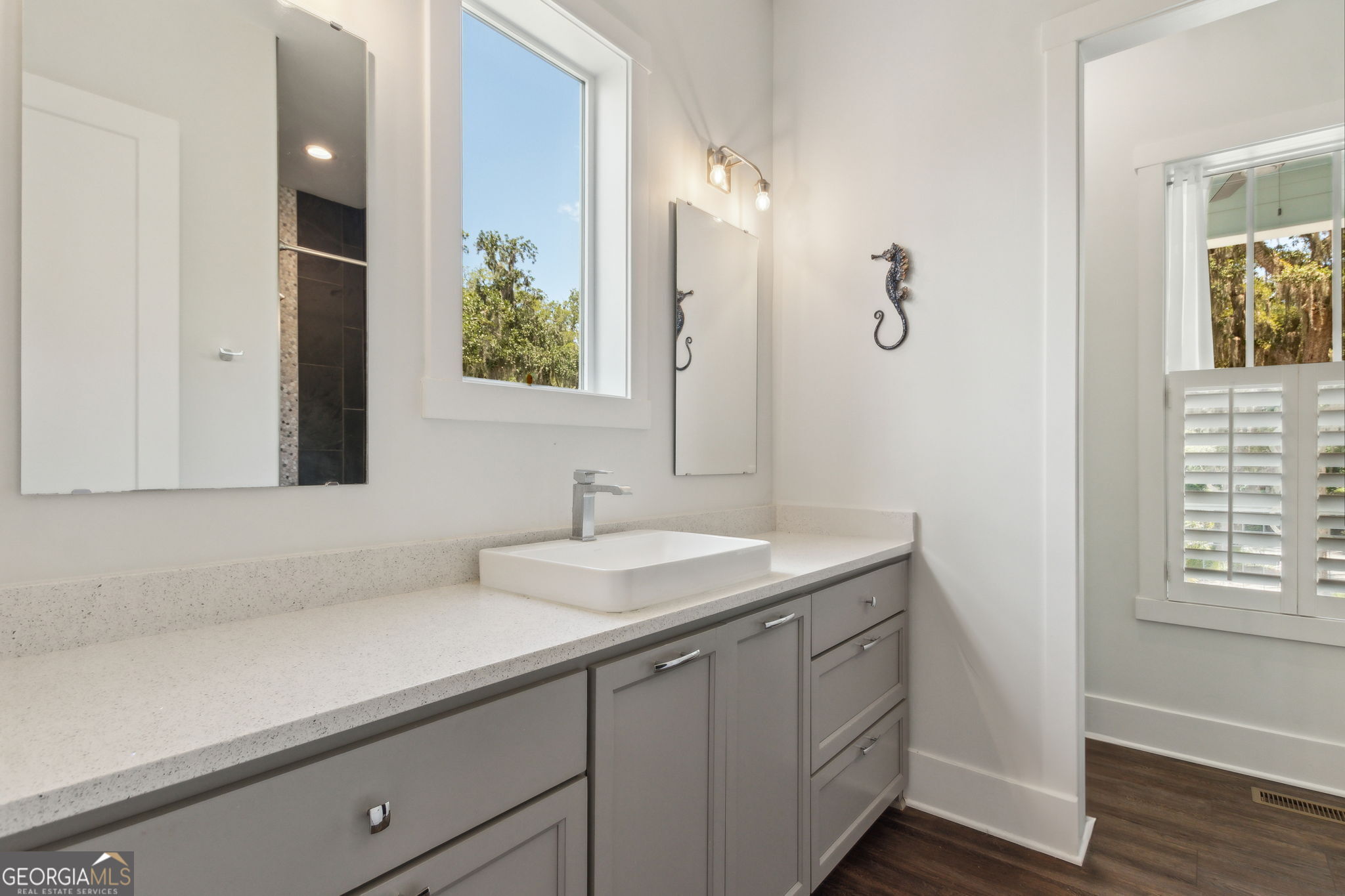 109 Becket Road St. Marys, GA 31558 - Photo 22 of 65 a bathroom with a sink and a mirror