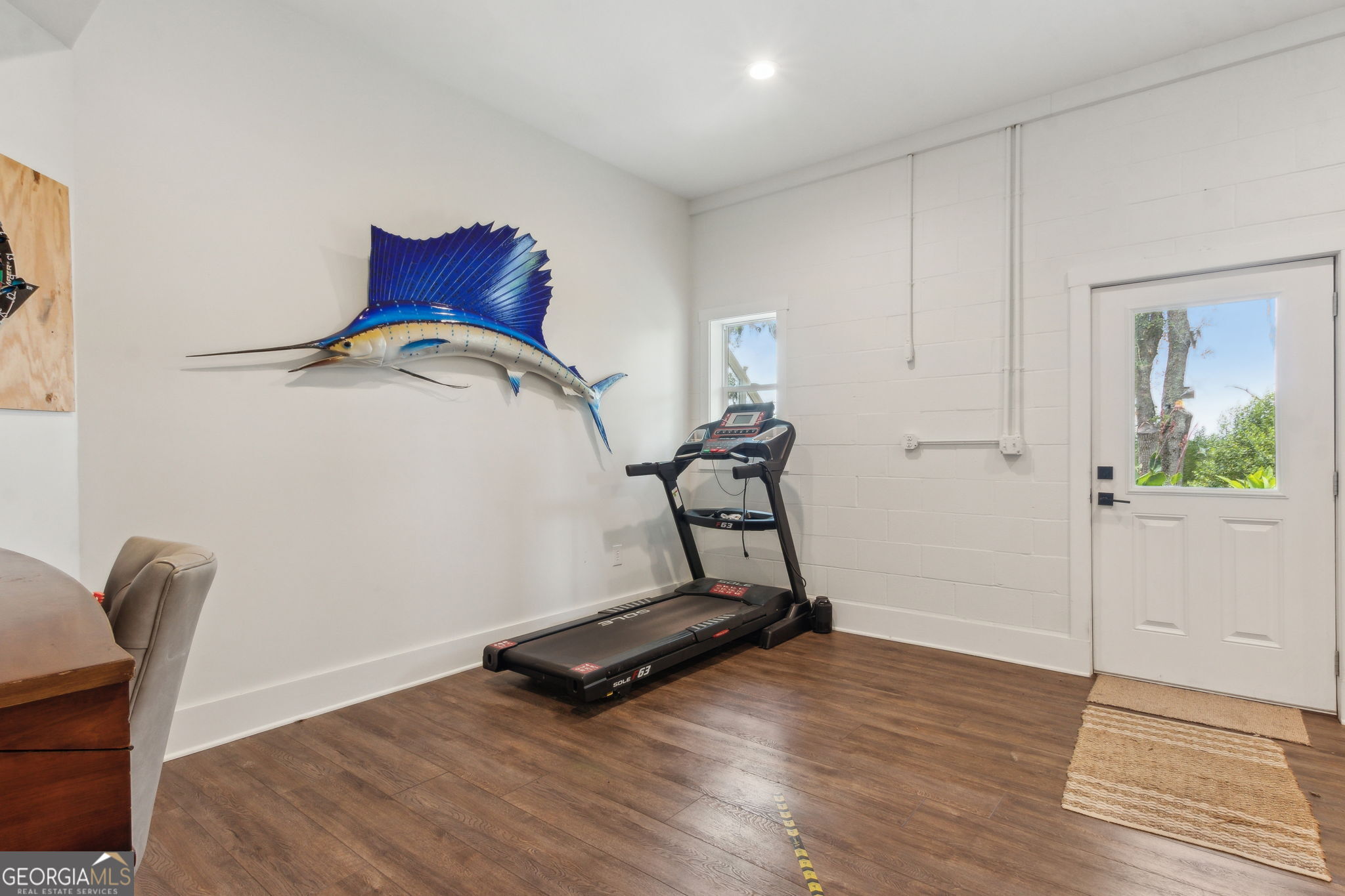 109 Becket Road St. Marys, GA 31558 - Photo 38 of 65 a room with gym equipment and wooden floor