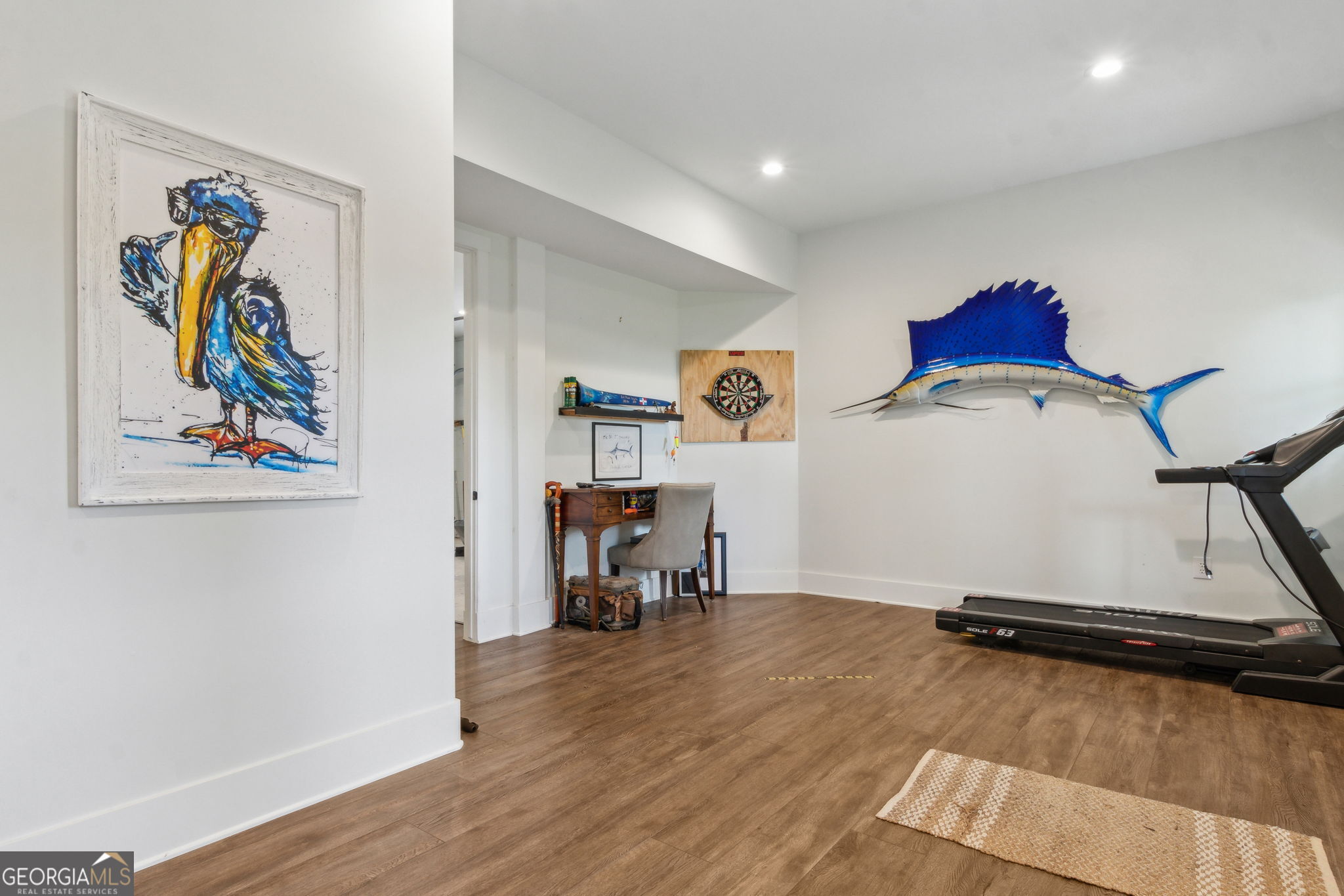 109 Becket Road St. Marys, GA 31558 - Photo 40 of 65 a room with gym equipment and wooden floor