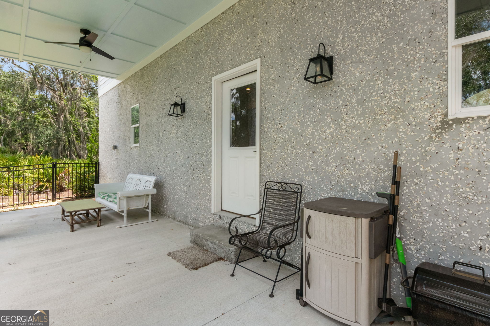 109 Becket Road St. Marys, GA 31558 - Photo 49 of 65 a view of a patio with table and chairs and potted plants