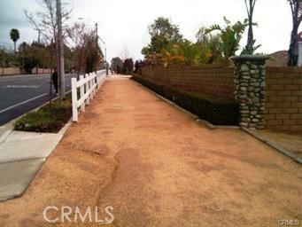 10379 Wilson Avenue Rancho Cucamonga, CA 91737 - Photo 5 of 6 a view of a pathway with a wrought fence