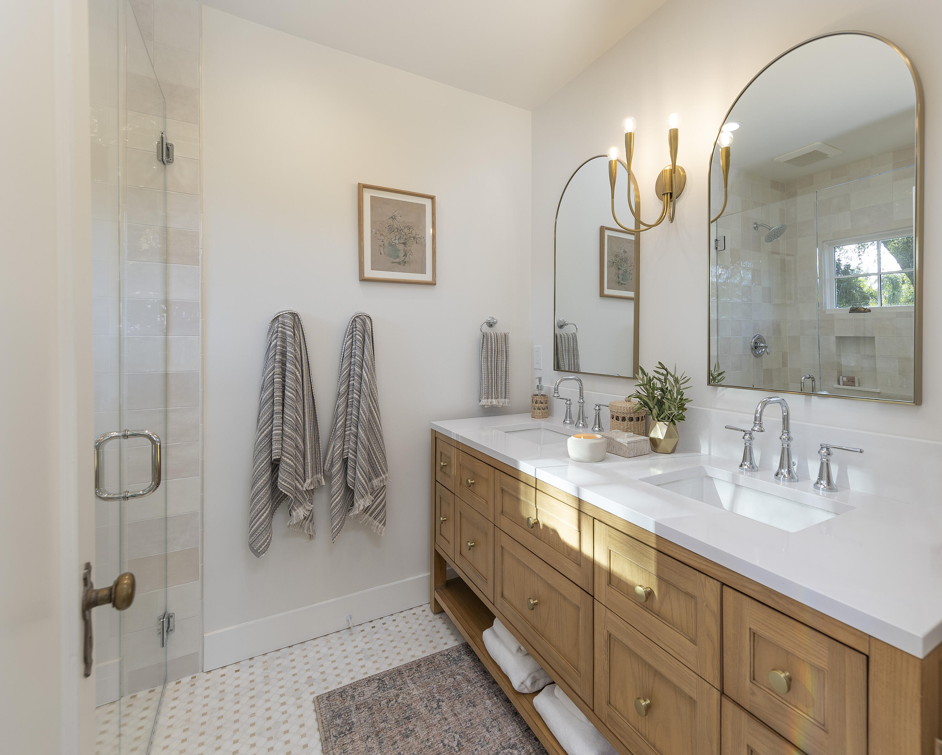 909 Chelham Way Montecito, CA 93108 - Photo 18 of 28 a bathroom with a double vanity sink and a mirror